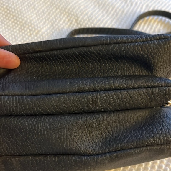 No brand navy blue leather small handbag. Gold metal design on the front. - Picture 7 of 10